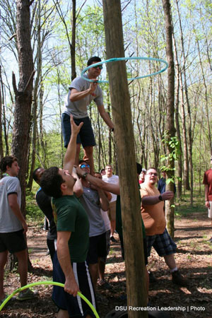 Members of Delta State University’s Sigma Alpha Epsilon fraternity participate in the “tower of trust” team-building exercise.